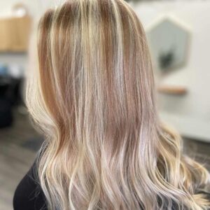 Long blond hairstyle with highlights.