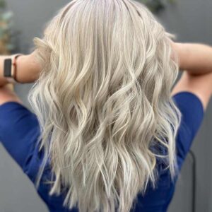 Blond woman with a fashionable hairstyle.